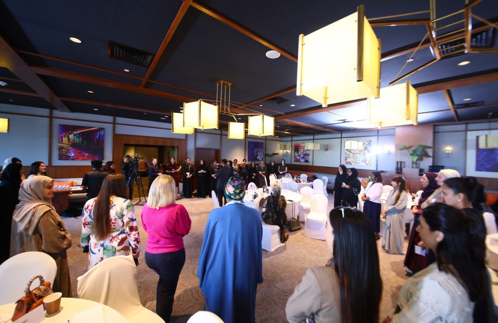 NOORA members and Aurora50 co-founder Diana Wilde form a circle around speaker Prof Dame Heather McGregor of Heriot-Watt University Dubai at a NOORA meet-up.