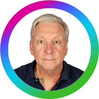 Aurora50 Inclusive Workplaces Summit Advisory Board - Peter Wheeler, Executive Director, UAE, Best Buddies. Small circular headshot rainbow-spectrum circle border