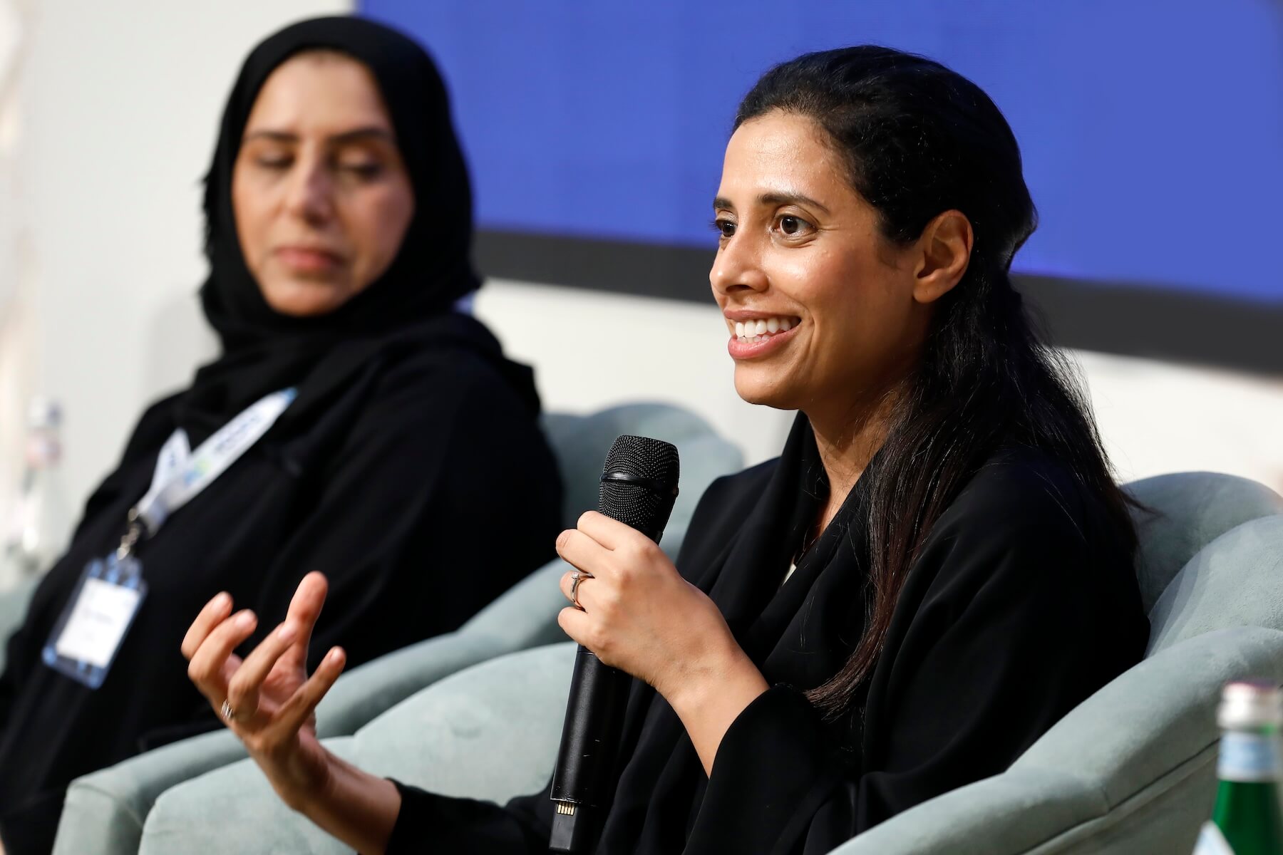 Laila Saif of EGA and another woman speaker at the Aurora50 NOORA launch event, 31 July 2023 in Dubai.