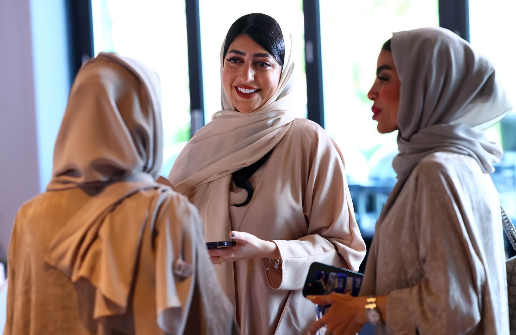 Hanadi Budebs of FAB talks to two other women at the NOORA workshop Women at the forefront in November 2023.