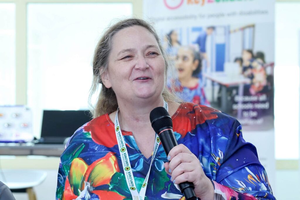 Ceanlia Vermeulen, Head of Inclusion and Wellbeing at Al Reef Charter School in Al Ain, speaking at Aurora50’s Inclusive Workplaces Summit 2024 at Zayed Higher Organization in Abu Dhabi on Preparing POD for Employment.