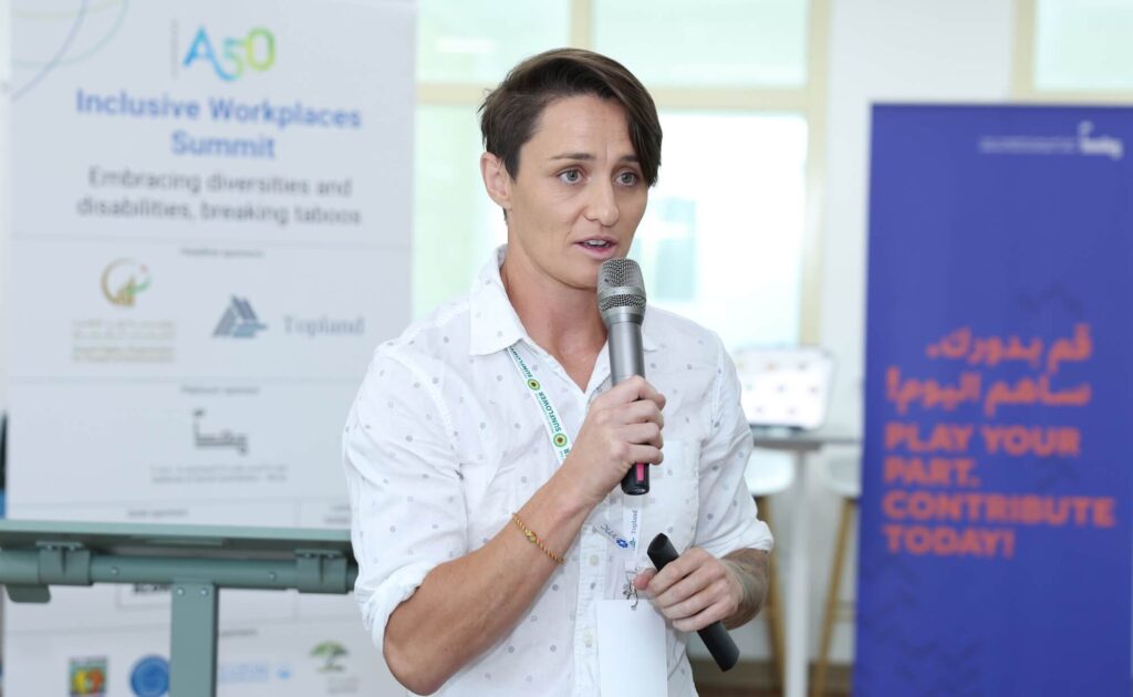 Hollie Murphy of Heroes of Hope speaks at Aurora50's Inclusive Workplaces Summit at Zayed Higher Organization in Abu Dhabi in November 2024.