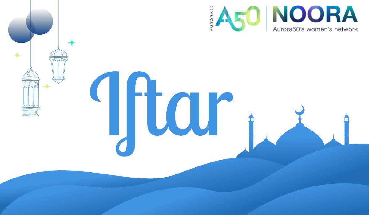 Graphic contains Aurora50 and NOORA logos with strapline Aurora50's women's network. Main text says Iftar. Illustration of two lanterns hanging with a second illustration of a mosque with four domes and two minarets with sand dunes in front.