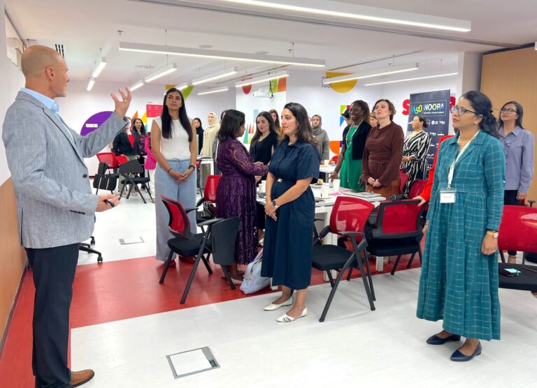 Aurora50's Finding Your Voice (public speaking) NOORA workshop on 9 May 2025 - Executive Voice Coach David Pope runs a standing exercise with NOORA members.